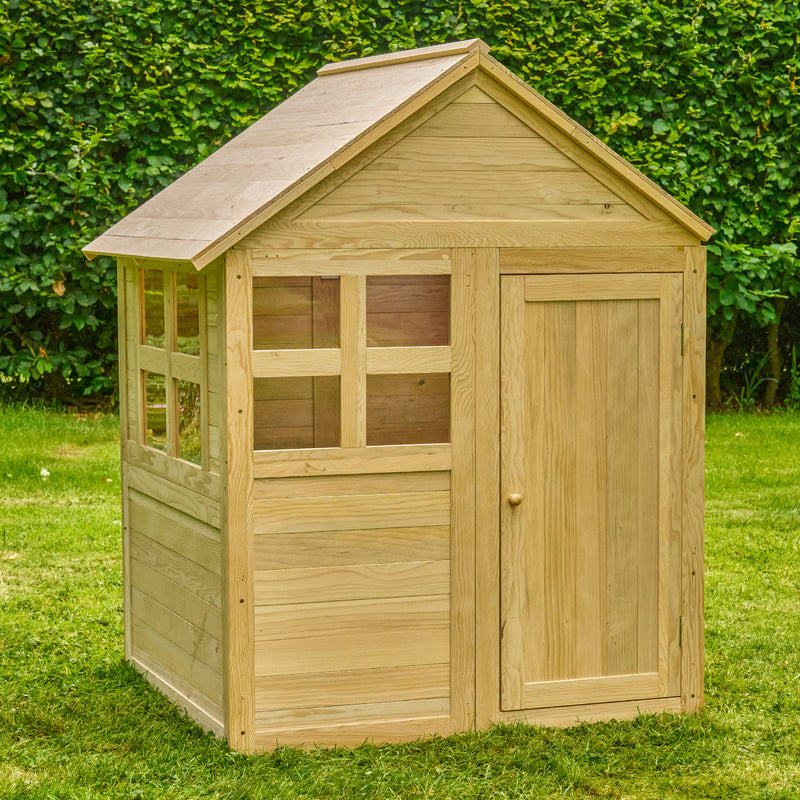 Maisonnette en bois FSC® dans un jardin.
