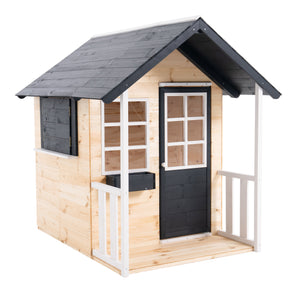 Maisonnette en bois pour enfants avec toit et porte noirs, fenêtres blanches et petite terrasse avec barrières.