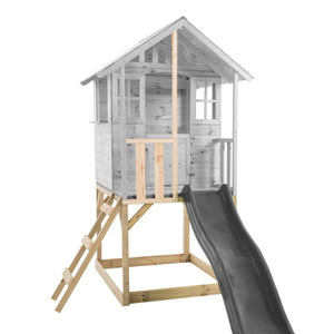 Plateforme surélevée en bois pour maisonnette modulable enfant, avec échelle d’accès et toboggan, maisonnette grisée à titre d’exemple.